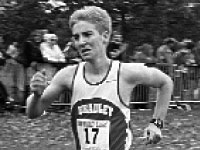 Sophomore Tim Owdom comes down the final stretch of race finishing ahead of a Wisconsin-Milwaukee opponent during the 8K run at Newman Golf Course.