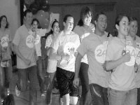 Dancers run into the Haussler Hall gym to kick off Dance Marathon last year.