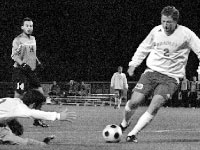 Junior Graham Stockdale kicks in his first goal of the season at Shea Stadium on Tuesday. Junior Chris Cutshaw assisted the goal as he was falling.