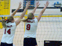 Junior Amy Reichel and freshman Megan Schmidt put their hands above the net to block Indiana State’s attempted kill.