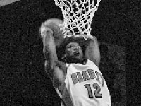 Senior Theron Wilson dunks the ball Monday against Lewis in their first exhibition game of the season.