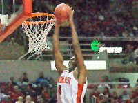 Senior center David Collins dunks the ball during the Braves exhibiton game on Sunday. The 84-79 loss was Bradley’s first exhibiton loss ever.