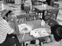 Students eat dinner in the Alumni Dining Room on Sunday night.