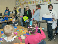 Students and faculty deliver supplies to an Irving School classroom in Peoria last Friday. The school was devastated by vandalism on Oct. 26. Bradley students and faculty raised about $1,300 and $500 worth of supplies for the school. Photo by Danise Jones