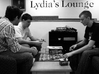 Senior physics secondary educatoin major Adam Kleage, sophomore nursing major Ben Henry and sophomore electrical engineering major Wes Martin play a game in Lydia’s Lounge. Photo by Adam Moulton