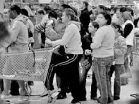 Shoppers crowd a store during a Black Friday sale. Although many Americans suffer financially because of the faltering economy, Black Friday sales increased six percent this year.