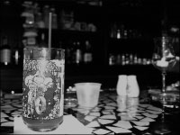 A Muppets glass sits on the broken tile and mirror bar at Blue, Main Street’s newest bar. The establishment is located at 619 W. Main St. and offers a unique experience, including board games and Snuggies for smoke breaks. Photo by Megan Loos