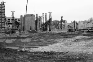 Construction workers build the new athletic performance center on Main Street. The center, the Westlake Hall renovation and the Hayden-Clark Alumni Center will be build with energy efficiencies higher than code requires. Photo by Megan Loos