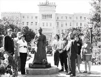 Student Senate places roses on Lydia Moss Bradley’s statue during the Founder’s Day celebration. Photo by Louis Amberg