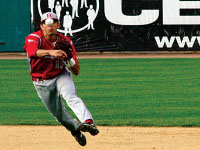 Freshman Jason Leblebijian sends a throw over to first during the Braves exhibition game against the Peoria Chiefs. Photo by Megan Loos