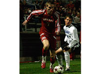 Sophomore Bryan Gaul attempts to keep the ball away from a Drake opponent. Bradley fell to Drake 3-1 in the homecoming game. Photo by Megan Loos