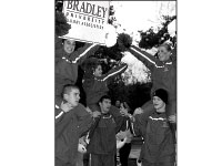 The cheerleaders show their spirit during this year’s Homecoming Week. Student Body President Kyle Malinowski and the Student Activities Office are planning more activities for the week designed to create school spirit. Photo by Adam Moulton