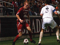 Sophomore Jochen Graf takes the ball down the field in Friday’s game against Western Michigan. Photo by Megan Loos
