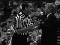 Coach Jim Les talks to a referee during a game this season. Next year, Les will have one more player to interact with during games. Photo by Megan Loos