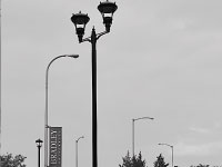 One of the new light poles on campus rests by CampusTown. The lighting project was started two years ago, and is nearing completion. The new lamps are brighter and more energy efficient. Photo by Adam Moulton