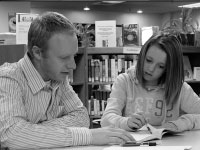 Senior Steven Fussner mentors an area Kelly Hallstrom as a part of the BU C.H.O.I.C.E.S. program. In additon to the mentoring, students host camps and provide incentives for young Peorians to stay on track. Photo by Megan Loos