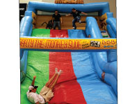 Students roll down the inflatable monkey slide at last Saturday’s Late Night BU. Photo by Adam Moulton