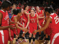 Senior Jenny Van Kirk high fives teammates as her name is announced for the starting lineup against Louisville at Freedom Hall in the Women’s Basketball Invitational. Bradley its won first ever postseason game beating Louisville 69-59. Photo courtesy of bradleybraves.com