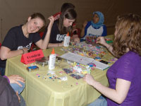 Students make condom containers at SEXtival last weekend. The event aimed to increase sexual health awareness. Photo by Dana Mashek