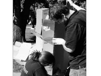 Students build cardboard shacks on the quad Wednesday afternoon at Shack-a-Thon. The event is sponsored by Habitat for Humanity and helps the group raise money to build a house in the Peoria area. Photo by Megan Loos