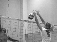 Freshman Alise Tupuritis attempts to block a shot during the Hotels at Grand Prarie Invitational earlier this season. Photo by Megan Loos