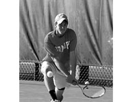 Sophomore Mitch Osbourne returns the ball winning the doubles match. Photo by Adam Moulton