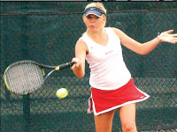 Senior Jessica Buterbaugh returns a shot against Creighton on Senior Day. Photo by Megan Loos