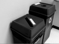 Two new recycling bins in University Hall’s lobby. The program in U-Hall is a pilot for the entire campus. Photo by Megan Loos